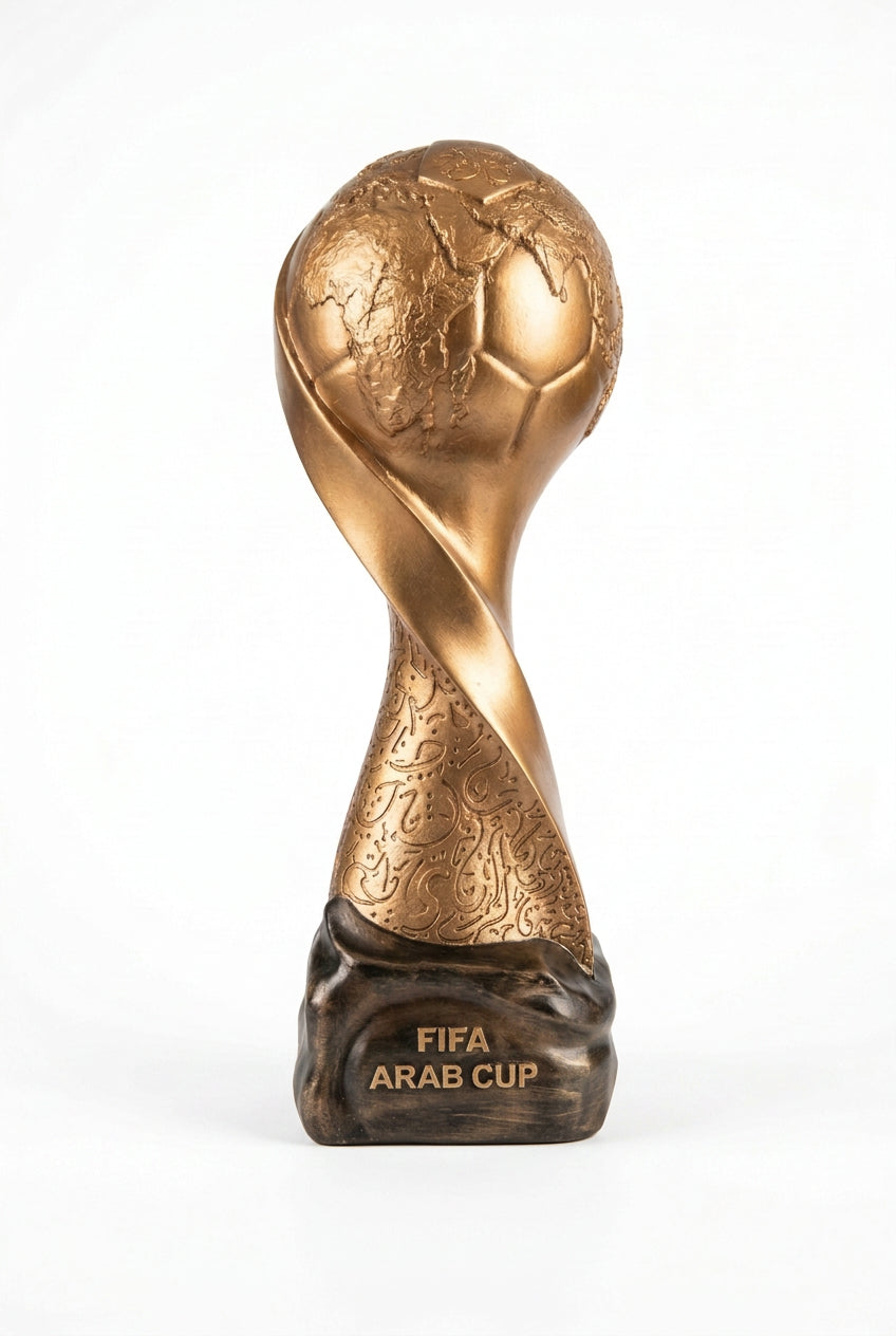 Golden FIFA Arab Cup trophy replicas in three sizes displayed on a shelf